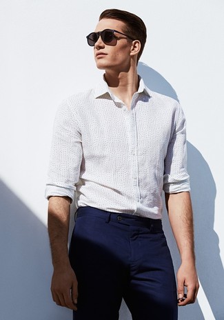 White and Navy Polka Dot Dress Shirt Outfits For Men: The pairing of a white and navy polka dot dress shirt and navy chinos makes for a really pulled together outfit.