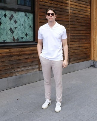 White and Black Leather Shoes with Pants Outfits For Men: Go for a white polo and pants for a comfortable ensemble that's also put together. On the fence about how to complement this ensemble? Rock white and black leather low top sneakers to turn up the wow factor.