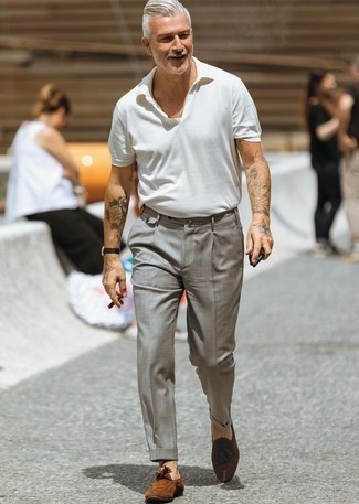 43 Dressy Hot Weather Outfits For Men: For a casually neat ensemble, rock a white polo with grey dress pants — these items work really well together. A trendy pair of brown suede tassel loafers is an effortless way to upgrade your look.