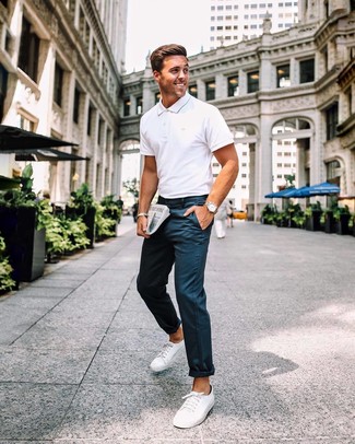 White Polo Outfits For Men: Combining a white polo with navy chinos is a savvy option for a relaxed but dapper getup. A pair of white canvas low top sneakers is a wonderful pick to complete your look.