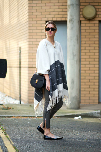 Black and White Leather Loafers Outfits For Women: This casual combo of a white horizontal striped poncho and grey leather skinny pants comes in useful when you need to look good but have zero time to spare. Turn up the dressiness of this outfit a bit by slipping into a pair of black and white leather loafers.