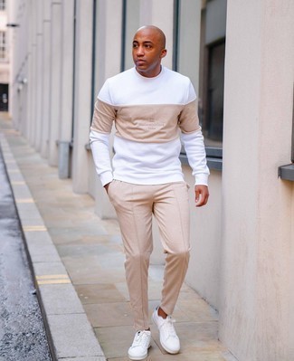 White Print Sweatshirt Outfits For Men: A white print sweatshirt and beige chinos? This is an easy-to-create ensemble that any gentleman could wear on a daily basis. White and navy canvas low top sneakers act as the glue that will bring this ensemble together.