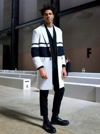 White Raincoat Outfits For Men: Go all out in a white raincoat and a black suit. Give a different twist to this ensemble by rounding off with black leather casual boots.
