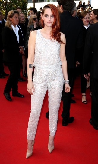 Kristen Stewart wearing White Sequin Jumpsuit, Beige Leather Pumps, Silver Bracelet