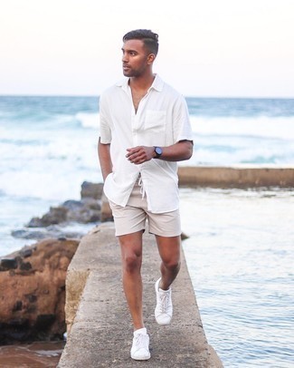 Beige Shorts Outfits For Men: For an ensemble that offers comfort and dapperness, wear a white short sleeve shirt and beige shorts. Consider a pair of white leather low top sneakers as the glue that will bring your outfit together.