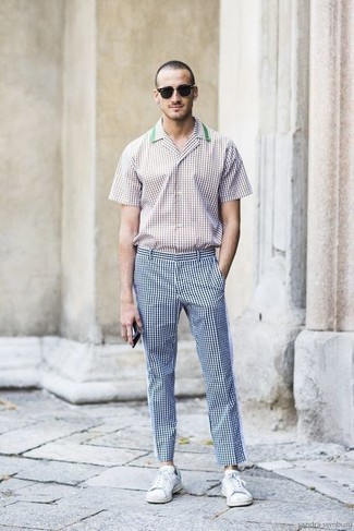 White and Black Check Short Sleeve Shirt Outfits For Men: This getup with a white and black check short sleeve shirt and navy check chinos isn't so hard to create and is easy to adapt. A pair of white and green leather low top sneakers is a savvy option to finish off your outfit.