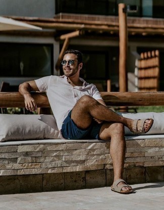 Tan Leather Sandals Outfits For Men: This laid-back combination of a white short sleeve shirt and navy shorts is a fail-safe option when you need to look casually cool in a flash. Finish with a pair of tan leather sandals to make an all-too-safe getup feel suddenly fresh.