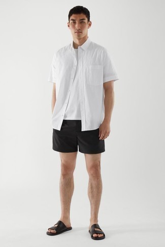 Black Leather Sandals Outfits For Men: This laid-back combo of a white short sleeve shirt and black shorts is ideal when you want to go about your day with confidence in your outfit. To give your outfit a more casual touch, why not introduce a pair of black leather sandals to your ensemble?