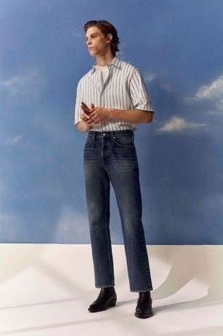 White Vertical Striped Short Sleeve Shirt Outfits For Men: For a laid-back ensemble, dress in a white vertical striped short sleeve shirt and navy jeans — these two items play really nice together. Dark brown leather chelsea boots will bring a hint of polish to an otherwise mostly dressed-down look.