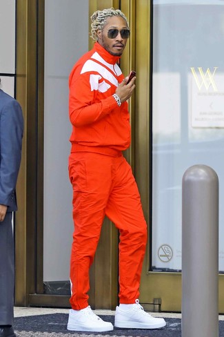 Future wearing White Socks, White Leather Low Top Sneakers, Orange Track Suit
