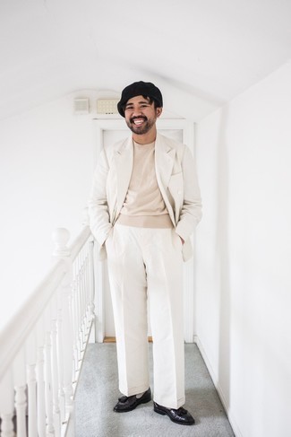Beige Crew-neck Sweater Dressy Outfits For Men: One of our favorite ways to style out such a timeless menswear piece as a beige crew-neck sweater is to marry it with a white suit. Complement your outfit with dark brown leather tassel loafers and the whole outfit will come together.