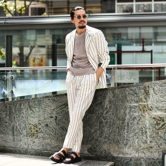 Black Leather Sandals Outfits For Men: This smart casual pairing of a white vertical striped suit and a grey crew-neck t-shirt is very easy to pull together in no time, helping you look amazing and ready for anything without spending a ton of time combing through your closet. For footwear, take the casual route with black leather sandals.