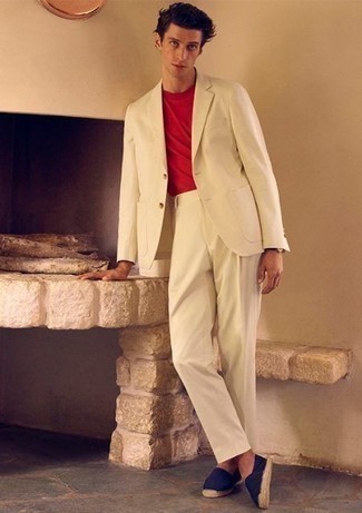 White Suit Outfits: This ensemble with a white suit and a red crew-neck t-shirt isn't hard to score and easy to adapt throughout the day. Does this outfit feel all-too-polished? Let a pair of navy canvas espadrilles spice things up.