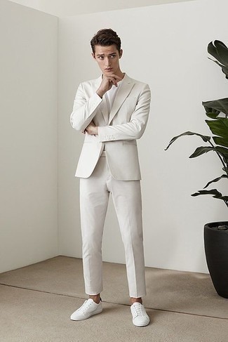 White Suit with Low Top Sneakers Summer Outfits In Their 20s: Consider pairing a white suit with a white crew-neck t-shirt to don a sleek and polished outfit. Feeling bold? Change things up a bit by finishing with a pair of low top sneakers. What better idea for a roasting hot hot weather afternoon? As you're going from your 20s to your 30s, you want to start dressing more maturely. That's when outfits like this become very relevant.