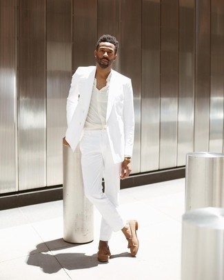 White Suit Outfits: Opt for a white suit and a white dress shirt to have all eyes on you. For something more on the casually edgy side to complement your outfit, add tan suede tassel loafers to the mix.