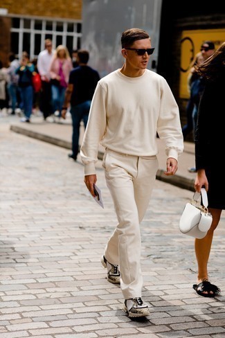 White Sweatshirt Outfits For Men: A white sweatshirt and beige chinos are a smart ensemble worth incorporating into your daily casual repertoire. And it's amazing what a pair of beige athletic shoes can do for the ensemble.