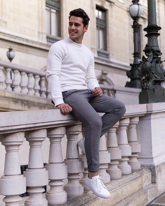 White Sweatshirt Outfits For Men: This casual combo of a white sweatshirt and grey chinos is perfect if you need to feel confident in your outfit. A pair of white canvas low top sneakers can integrate perfectly within many ensembles.