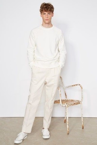 White Sweatshirt Outfits For Men: A white sweatshirt and white chinos are indispensable menswear staples if you're picking out a casual closet that matches up to the highest sartorial standards. A pair of white canvas low top sneakers is a savvy pick to round off your ensemble.
