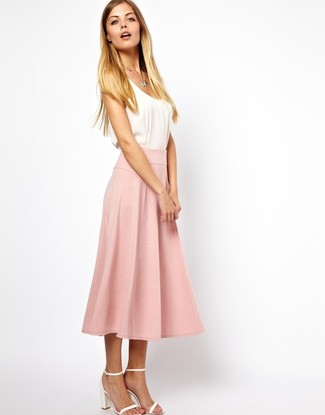 Pink Pleated Midi Skirt Outfits: This pairing of a white tank and a pink pleated midi skirt is undeniable proof that a simple casual look doesn't have to be boring. If you need to effortlessly spruce up this look with footwear, introduce a pair of white leather heeled sandals to this look.