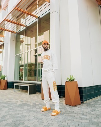 Orange Beanie Outfits For Men: Want to inject your closet with some casual city style? Wear a white track suit and an orange beanie. If you're hesitant about how to round off, a pair of orange canvas sandals is a never-failing option.