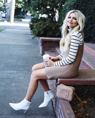 White Leather Ankle Boots Outfits: If you're looking to take your casual style up a notch, consider pairing a white horizontal striped turtleneck with a beige knit tank dress. Amp up this look by slipping into a pair of white leather ankle boots.