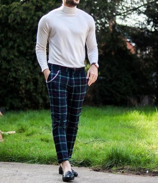 Navy Plaid Chinos Outfits: Dress in a white turtleneck and navy plaid chinos for a neat and relaxed and trendy look. Boost the dressiness of your getup a bit by rounding off with black leather loafers.