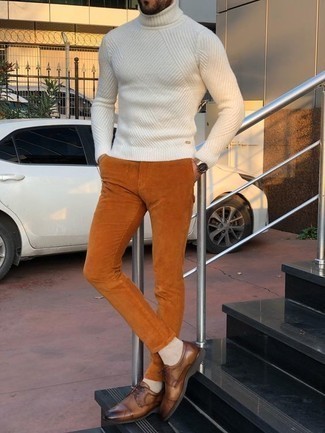 Brown Corduroy Chinos Outfits: Consider teaming a white wool turtleneck with brown corduroy chinos to pull together an interesting and modern-looking relaxed casual ensemble. Clueless about how to finish your getup? Wear brown leather derby shoes to ramp up the classy factor.