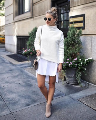 Beige Suede Ankle Boots Outfits: If you're looking for a casual and at the same time stylish getup, marry a white knit turtleneck with a white shirtdress. To bring a little depth to your outfit, add a pair of beige suede ankle boots to the mix.