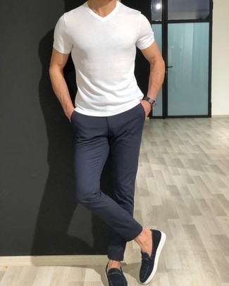 Charcoal Leather Watch Outfits For Men: This relaxed combo of a white v-neck t-shirt and a charcoal leather watch is a solid bet when you need to look dapper in a flash. For an on-trend hi/low mix, complete your look with a pair of black canvas loafers.