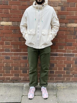 Olive Chinos Outfits: This on-trend outfit is really pared down: a white windbreaker and olive chinos. Take the casual route when it comes to shoes by finishing with pink athletic shoes.