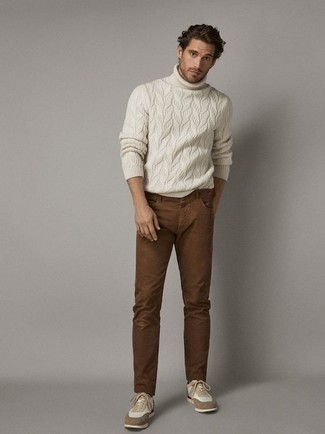 White Knit Turtleneck Outfits For Men: If you're a fan of relaxed casual combinations, why not wear this pairing of a white knit turtleneck and brown jeans? For something more on the daring side to complement this outfit, complement your ensemble with tan athletic shoes.
