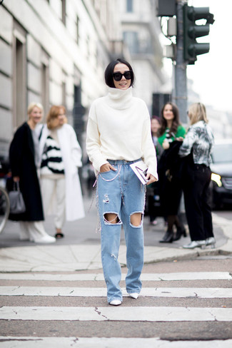 Light Blue Ripped Jeans Outfits For Women: Consider pairing a white wool turtleneck with light blue ripped jeans to put together an everyday look that's full of charm and character. To give your look a more sophisticated vibe, why not complete this look with a pair of white leather pumps?
