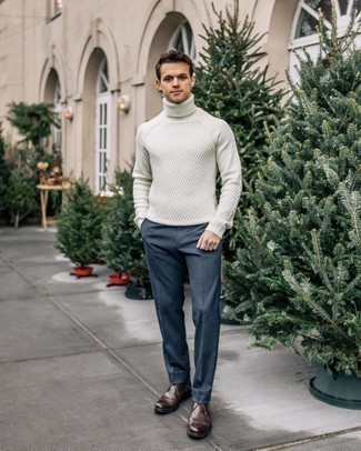 Blue Dress Pants Outfits For Men: Hard proof that a white knit wool turtleneck and blue dress pants are amazing when paired together in a polished ensemble for a modern dandy. Dark brown leather desert boots can effortlessly play down an all-too-refined look.
