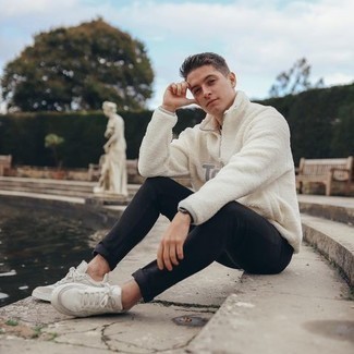 White Fleece Zip Neck Sweater Outfits For Men: For an off-duty ensemble with a twist, opt for a white fleece zip neck sweater and black jeans. Got bored with this look? Introduce white canvas low top sneakers to change things up a bit.