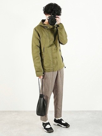 Olive Windbreaker Outfits For Men: This off-duty pairing of an olive windbreaker and khaki houndstooth chinos is a life saver when you need to look casual and cool but have zero time to dress up. To give your overall outfit a more casual aesthetic, introduce a pair of black and white athletic shoes to the equation.