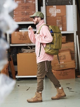 Olive Canvas Backpack Outfits For Men: A pink windbreaker and an olive canvas backpack are a savvy combo to have in your current styling repertoire. Our favorite of a countless number of ways to round off this ensemble is with tan leather casual boots.