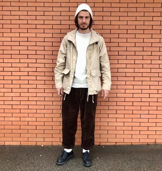 Tan Windbreaker Outfits For Men: This cool and relaxed look is so simple: a tan windbreaker and dark brown corduroy chinos. Let your outfit coordination skills truly shine by finishing this outfit with black leather desert boots.