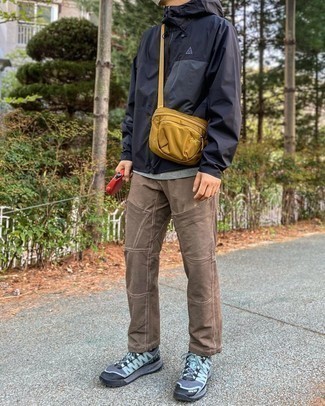 Tobacco Canvas Messenger Bag Outfits: Demonstrate that nobody does casual like you in a black windbreaker and a tobacco canvas messenger bag. When it comes to footwear, this ensemble pairs nicely with charcoal athletic shoes.