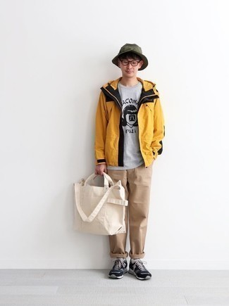 Dark Green Bucket Hat Outfits For Men: This off-duty pairing of a mustard windbreaker and a dark green bucket hat is a tested option when you need to look stylish in a flash. Complement your look with a pair of navy and white athletic shoes and the whole look will come together perfectly.