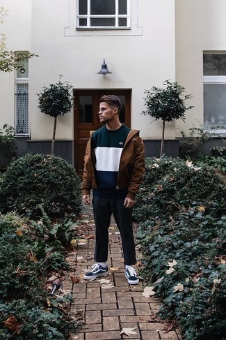 Tobacco Windbreaker Outfits For Men: This combination of a tobacco windbreaker and charcoal chinos is very easy to do and so comfortable to work as well! Let your outfit coordination expertise truly shine by finishing this ensemble with a pair of navy and white canvas low top sneakers.