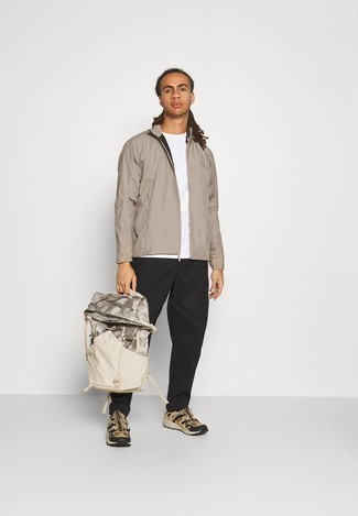 Beige Windbreaker Outfits For Men: A beige windbreaker and black chinos are a smart combo worth having in your current fashion mix. To give your overall outfit a more casual touch, why not introduce a pair of tan athletic shoes to this ensemble?