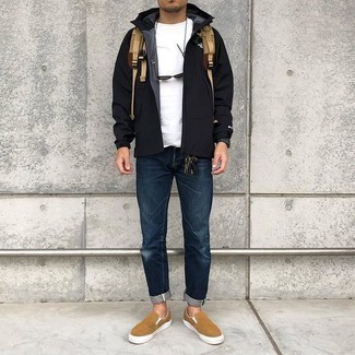 500+ Spring Outfits For Men: When the setting allows off-duty dressing, consider wearing a black windbreaker and navy jeans. On the footwear front, this look is finished off nicely with tan canvas slip-on sneakers. So if you're on the lookout for a look that's on-trend but also feels totally spring-appropriate, this is it.