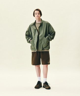 Olive Windbreaker Outfits For Men: This combo of an olive windbreaker and dark brown sports shorts is super easy to do and so comfortable to wear a variation of from dawn till dusk as well! Dark brown athletic shoes are a stylish companion to your outfit.