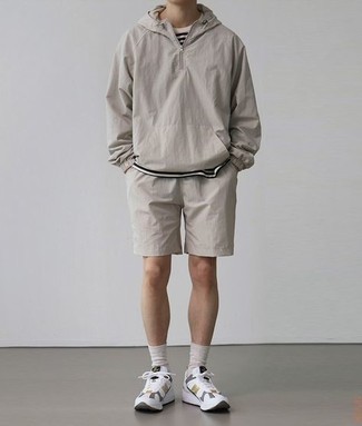 Grey Windbreaker Outfits For Men: To put together a casual getup with an urban twist, you can dress in a grey windbreaker and grey sports shorts. White athletic shoes will pull this full ensemble together.