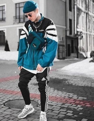 Olive Windbreaker Outfits For Men: Thumbs up to this contemporary combo of an olive windbreaker and black sweatpants! Shake up this getup with a more laid-back kind of shoes, like this pair of white and black athletic shoes.