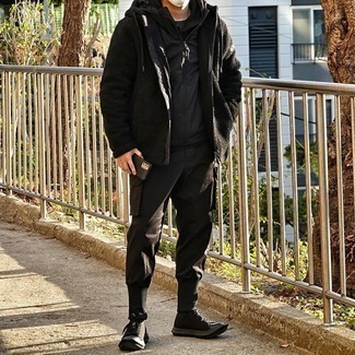 Black Fleece Hoodie Outfits For Men: A black fleece hoodie and dark brown cargo pants worn together are a match made in heaven for those dressers who appreciate casual styles. When in doubt about the footwear, go with dark brown canvas low top sneakers.
