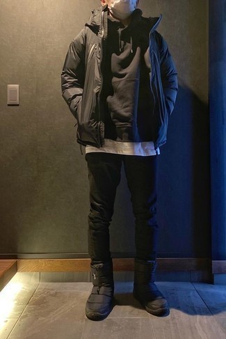 Black Canvas Snow Boots Outfits For Men: This off-duty pairing of a black windbreaker and black jeans will attract attention wherever you go. Jazz up your look with more relaxed footwear, like this pair of black canvas snow boots.
