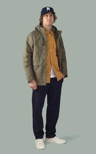 Tobacco Long Sleeve Shirt Outfits For Men: A tobacco long sleeve shirt and navy chinos paired together are a sartorial dream for those who appreciate casual combos. White canvas low top sneakers are the simplest way to punch up this outfit.