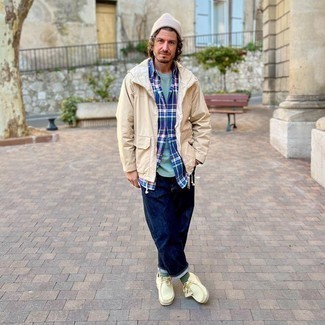 Tan Windbreaker Outfits For Men: This relaxed combo of a tan windbreaker and navy jeans is super easy to pull together in no time, helping you look on-trend and ready for anything without spending a ton of time combing through your closet. Feeling venturesome? Spice things up by rounding off with beige suede desert boots.