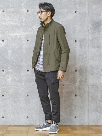Olive Windbreaker Outfits For Men: Try pairing an olive windbreaker with charcoal cargo pants for both on-trend and easy-to-style getup. To introduce a touch of stylish casualness to your ensemble, complement your getup with a pair of grey athletic shoes.